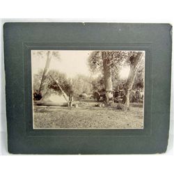 C. 1890'S MOUNTED PHOTO OF A NATIVE AMERICAN INDIAN AT FUR CAMP