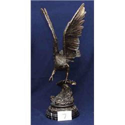 1 BRONZE-EAGLE WITH WINGS SPREAD ON ONE CLAW ON BRANCH WITH ADDED MARBLE BASE....