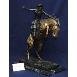 1 BRONZE-COWBOY ON BUCKING HORSE OF FREDERICK REMINGTON. X 20"H. WITH ADDED MARBLE BASE....