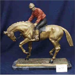 1 BRONZE-JOCKEY ON HORSE RECAST L. BONHEUR, 24"L X 24"H, WITH RED TOP AND BLACK PANTS. ON ADDED B...