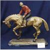 Image 1 : 1 BRONZE-JOCKEY ON HORSE RECAST L. BONHEUR, 24"L X 24"H, WITH RED TOP AND BLACK PANTS. ON ADDED B...