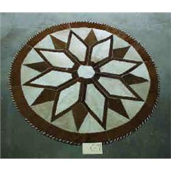 1 COWHIDE RUG-ROUND-4.9" DIAM....