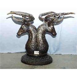 A 1 BRONZE TWO DEERHEADS WITH THAT WILL SUPPORT A TOP MAKING A TABLE. 31"H, 30"W. NO GLASS....