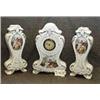 Image 1 : 1 CLOCK-MANTLE CLOCK 11"WX17" H WITH TWO SIDE VASES. POSSIBLY BY FABER, GERMANY. SPRING BROKEN....