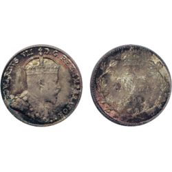 1905. PCGS graded Mint State-65. This piece exhibits medium heavy, iridescent rainbow toning. Anothe