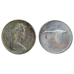 1967. ICCS Mint State-65. Medium heavy golden toning, with hints of blue. A Gem.