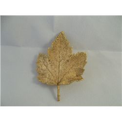 Vintage gold tone leaf pin