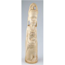 20th Century: African carved ivory figure of mother and child