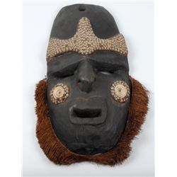 20th Century: Papua New Guinea ceremonial tribal masks and axe