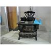 Cast metal cresent toy stove