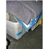 Image 1 : One plastic storage bin full of packing blankets