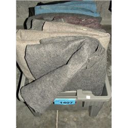 One plastic storage bin full of packing blankets