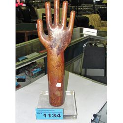 Switzer bronze hand symbolizing wealth and