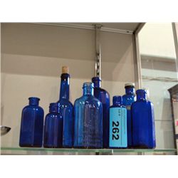 Lot of 8 vintage blue glass medicine bottles