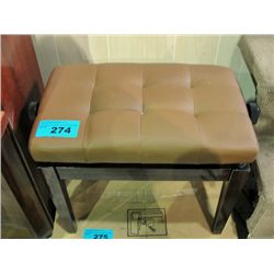 Beige leather seatted adjustable piano bench