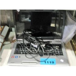 Toshiba laptop computer with power cord and bag of