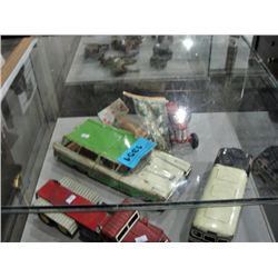 Collection of vintage childrens toys; tin trucks,
