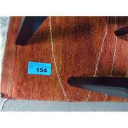 Orange wool area rug