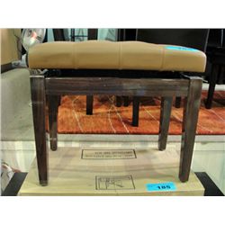 Beige leather padded adjustable height piano bench