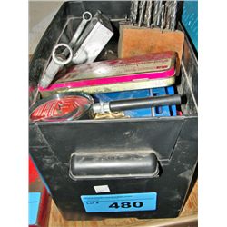 Black plastic storage box full of assorted tools