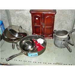 Shelf lot of assorted pots and pans and a wooden