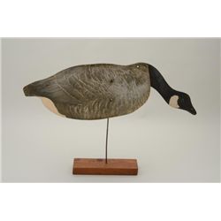 Large Johnson’s folding goose decoy on wood  stand, approx. 32” long when extended by 9”  in height 