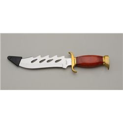 Rocky Mountain Raider knife and scabbard with  factory box by Frost in like new condition.   Est.:  