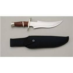 Stainless steel skinning knife, approx. 12”  overall with an 8” blade, like new in the box  with she