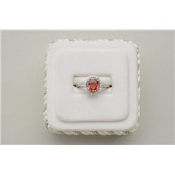 One 14k white gold ring set with a exotic  2.04ct a   Padparadsha  or orange sapphire  and diamonds.