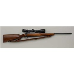 Ruger Model 77 bolt action rifle, 7 X 57  Mauser cal., 22” barrel, blue finish,  checkered wood stoc