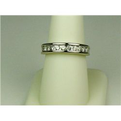 Classic14 karat white gold ladies anniversary  design ring channel set with 11 round  diamonds weigh