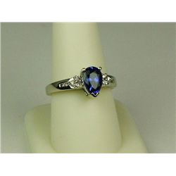 Elegant 14 karat white gold ladies ring set  with a fine blue pear shape blue Tanzanite  weighing ap