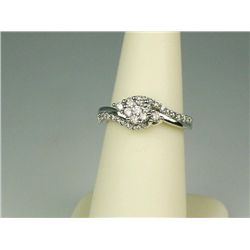 Dazzling 10 karat white gold ladies ring  micro set with 32 round diamonds weighing  approx. 0.60 ca