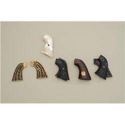 Lot of Colt grips including 1 pair of good  pearl grips. 2 reproduction eagle grips that  are very g