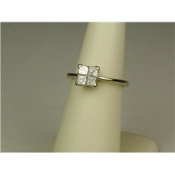Brilliant 18 karat white gold ladies ring  invisible set with 4 princess cut diamonds  weighing appr