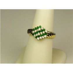 Very high quality 14 karat yellow gold ladies  ribbed design ring set with 30 intense green  emerald