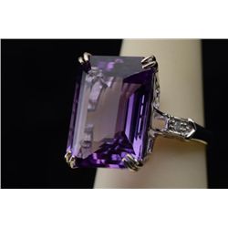 Exquisite 14 karat white gold ladies designer  ring set with a fine emerald cut Amethyst  weighing a
