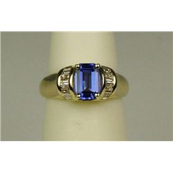 Gorgeous 14 karat yellow gold ladies ring set  with a very fine Tanzanite weighing approx.  1.00 car