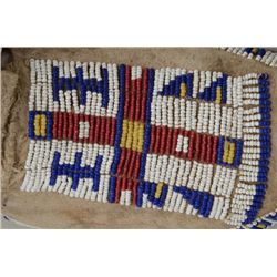 Pair of sinew sewn Indian beaded moccasins,  circa turn of the 19th to 20th century in  overall near