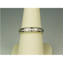 Classic 14 karat white gold ladies  anniversary band channel set with 10 princess  cut diamonds weig