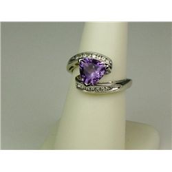 Stylish 14 karat white gold ladies ring set  with a trilliant cut Amethyst weighing  approx. 2.00 ca