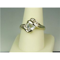 Stylish 14 karat yellow gold ladies ring set  with a trilliant cut Aquamarine weighing  approx. 1.50