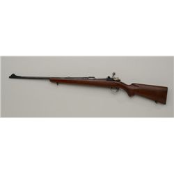 Sporterized bolt action rifle using a  Belgian-made FN receiver and a J.C. Higgins  Model 50 barrel,