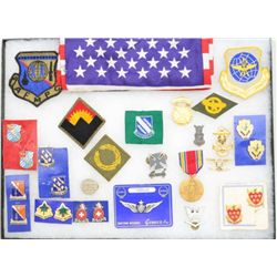 Lot of misc. U.S. military patches, pins,  medals and insignias in riker case.  Est.:   $50-$75.