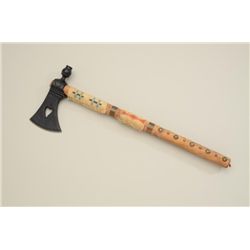 Reproduction metal tomahawk with decorated  wood shaft; a great decorator.  Est.:   $25-$50.