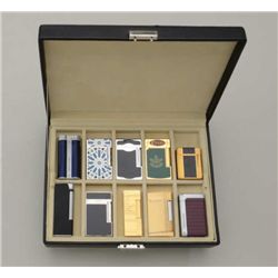 Display box containing 10 assorted fancy  flint cigarette lighters including two marked  Porsche Des