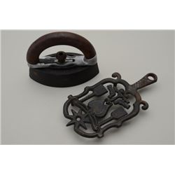 Antique iron with wooden handle and cast iron  trivet base; great decorators.  Est.:   $50-$75.