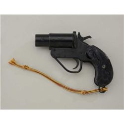 Flare pistol by unknown maker, #125821, black  finish, action is working, left side of  frame is scr