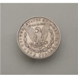 1884S silver dollar almost uncirculated.   Est. $50 to $100.
