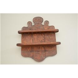 Carved pipe rack with 6 pipes also extra  pieces. One burled wood marked Lecor.  Estimate $100-$300.